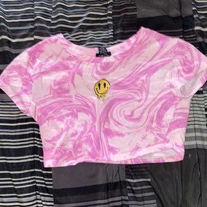 Small pink swirl crop top from Rue 21. Drip smiley face in center.
